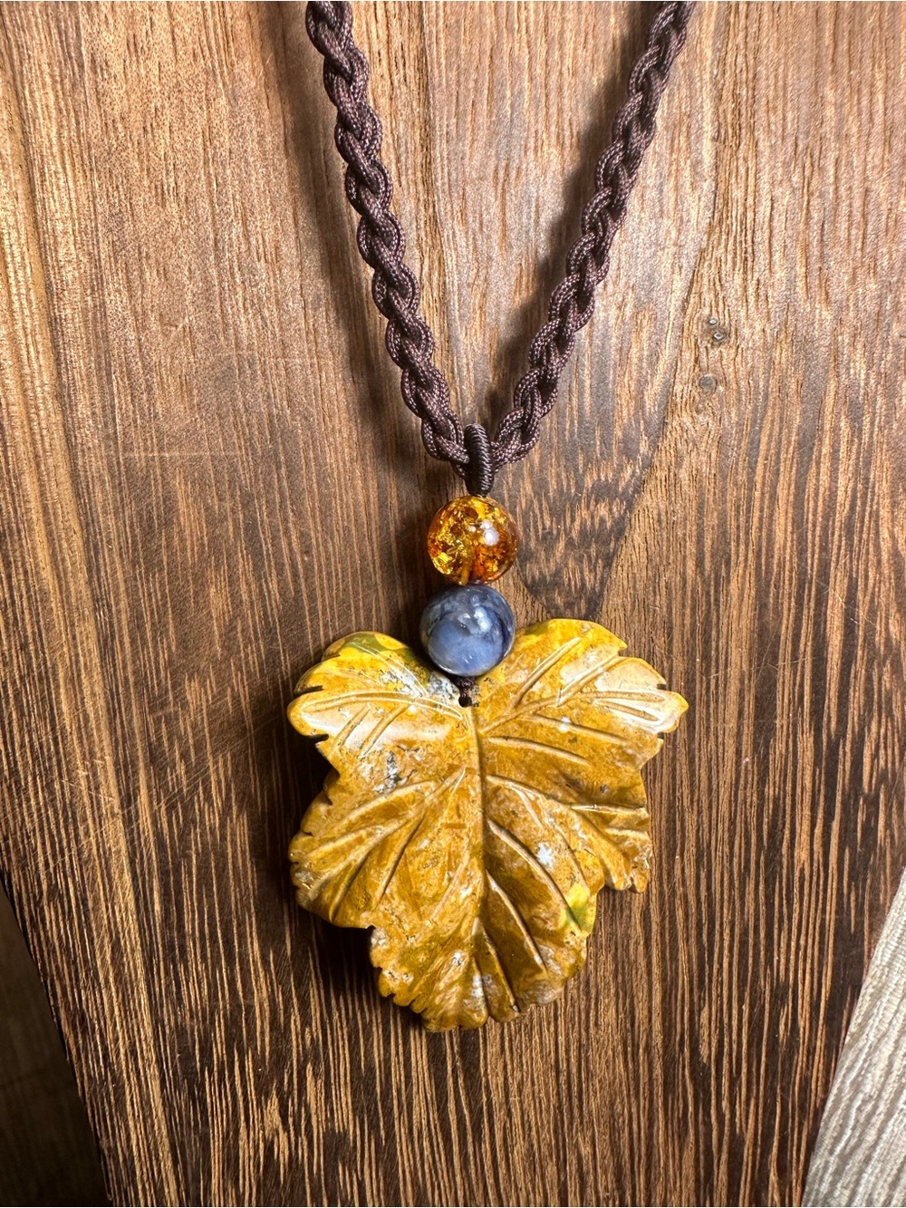 Yellow Ocean Jasper Leaf Carving Pendant Necklace on Brown Braided Rope - Picture 8 of 13